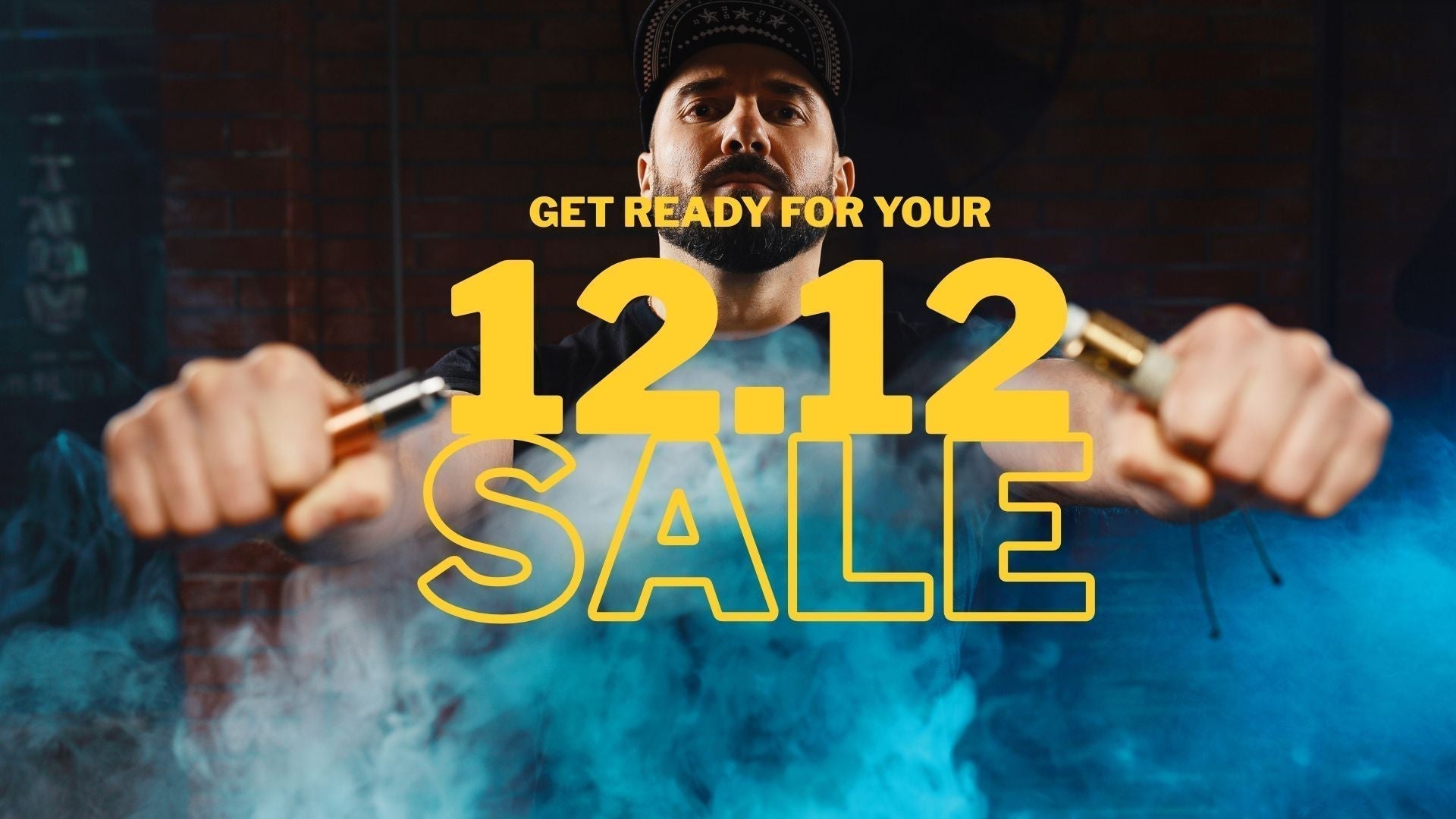 Man holding two vape devices with smoke around him, standing in front of bold yellow text promoting a 12.12 sale.